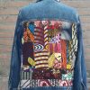 Jeans jas met patchwork.